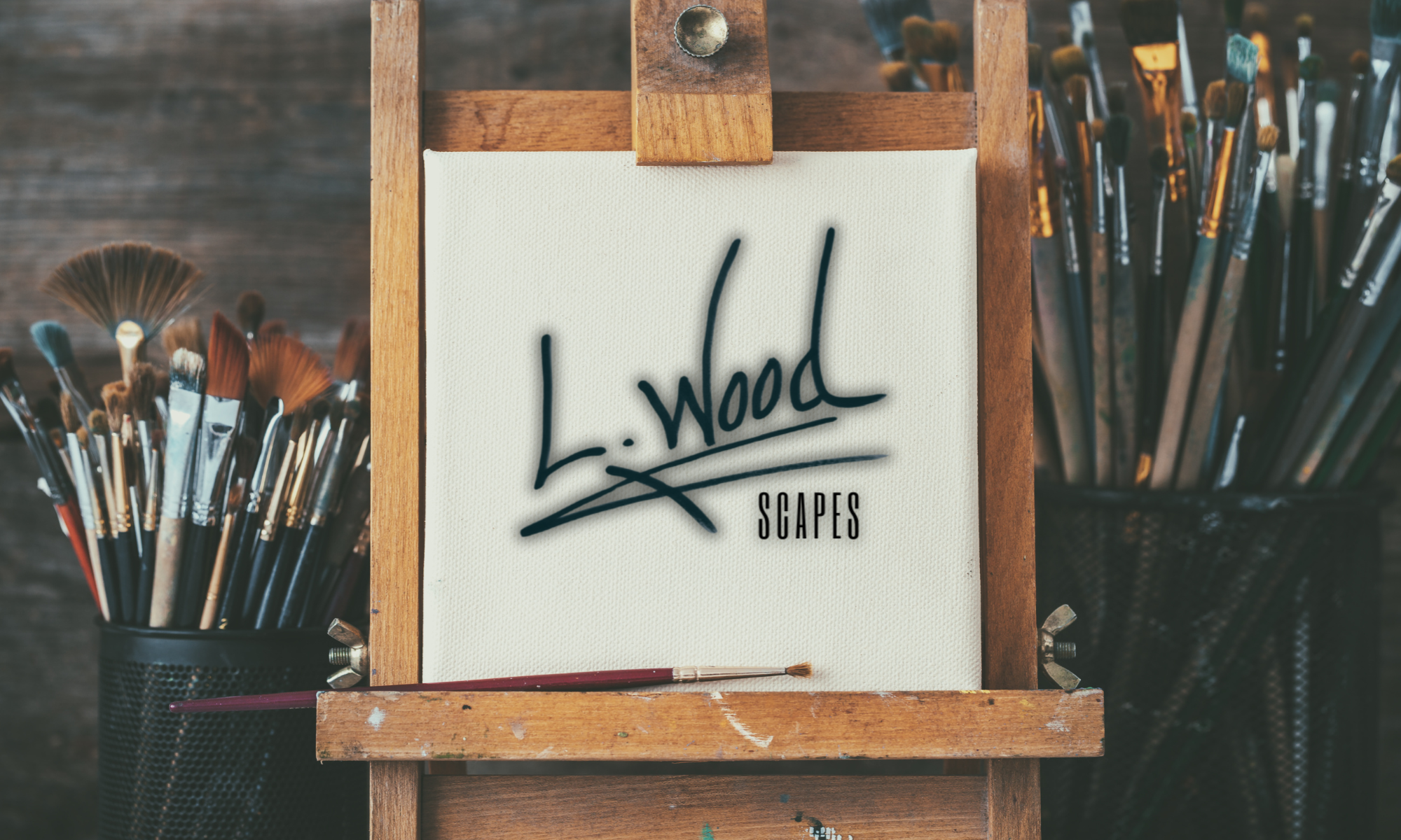Blank canvas on an easel displaying the L. Wood Scapes logo, symbolizing the beginning of a new nature-inspired artwork by Laura Wood